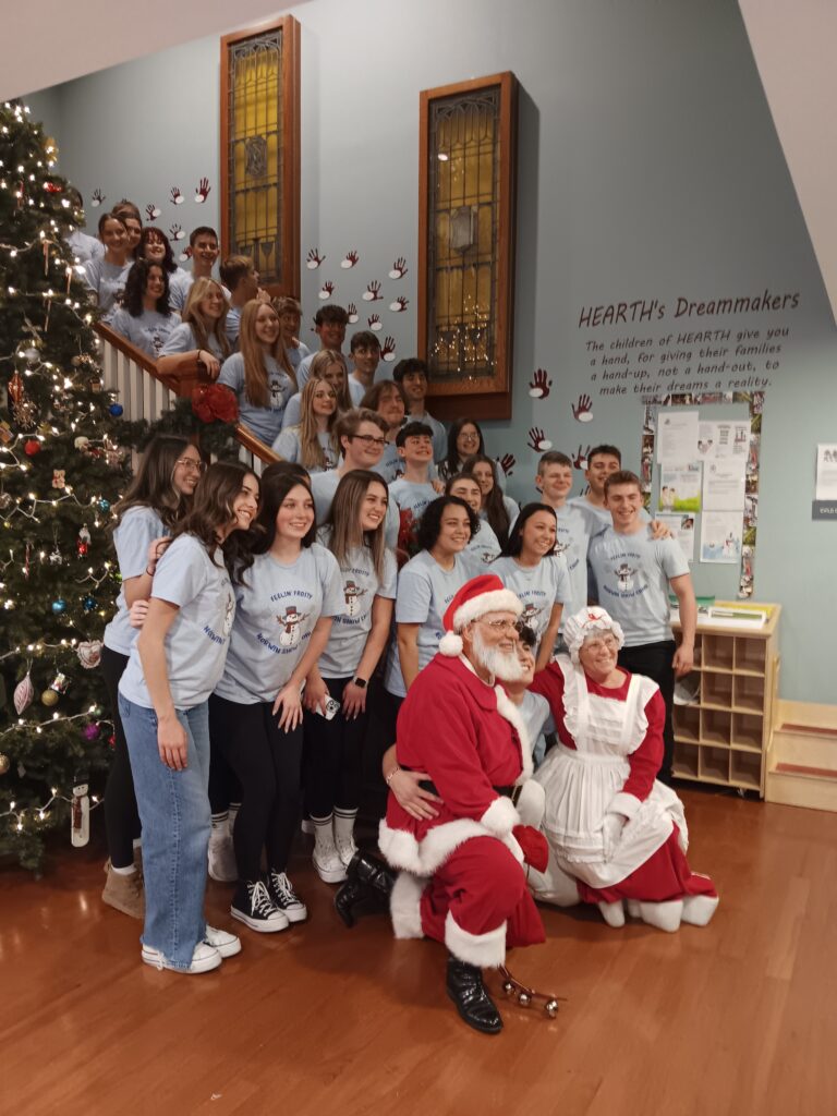 The Norwin Show Choir poses with Santa and Mrs. Claus