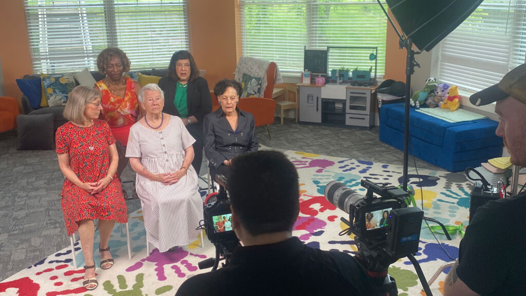 Five founders sit together for a photo shoot