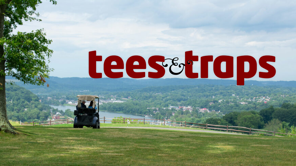Golf cart overlooking a valley with tees and traps logo